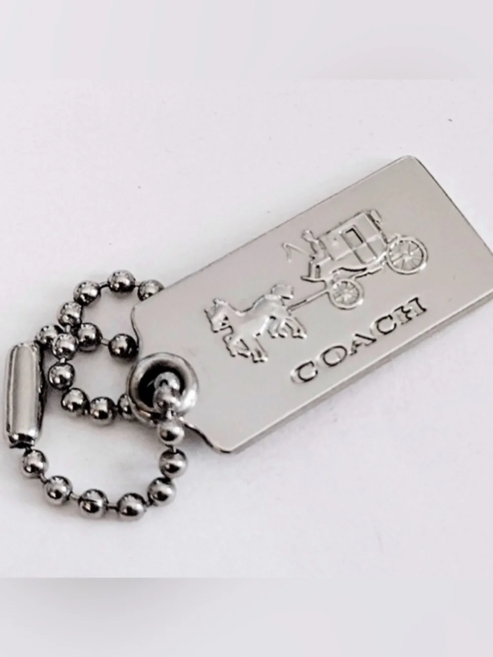 Coach Silver Tone Embossed Horse & Carriage Dog Tag Keychain